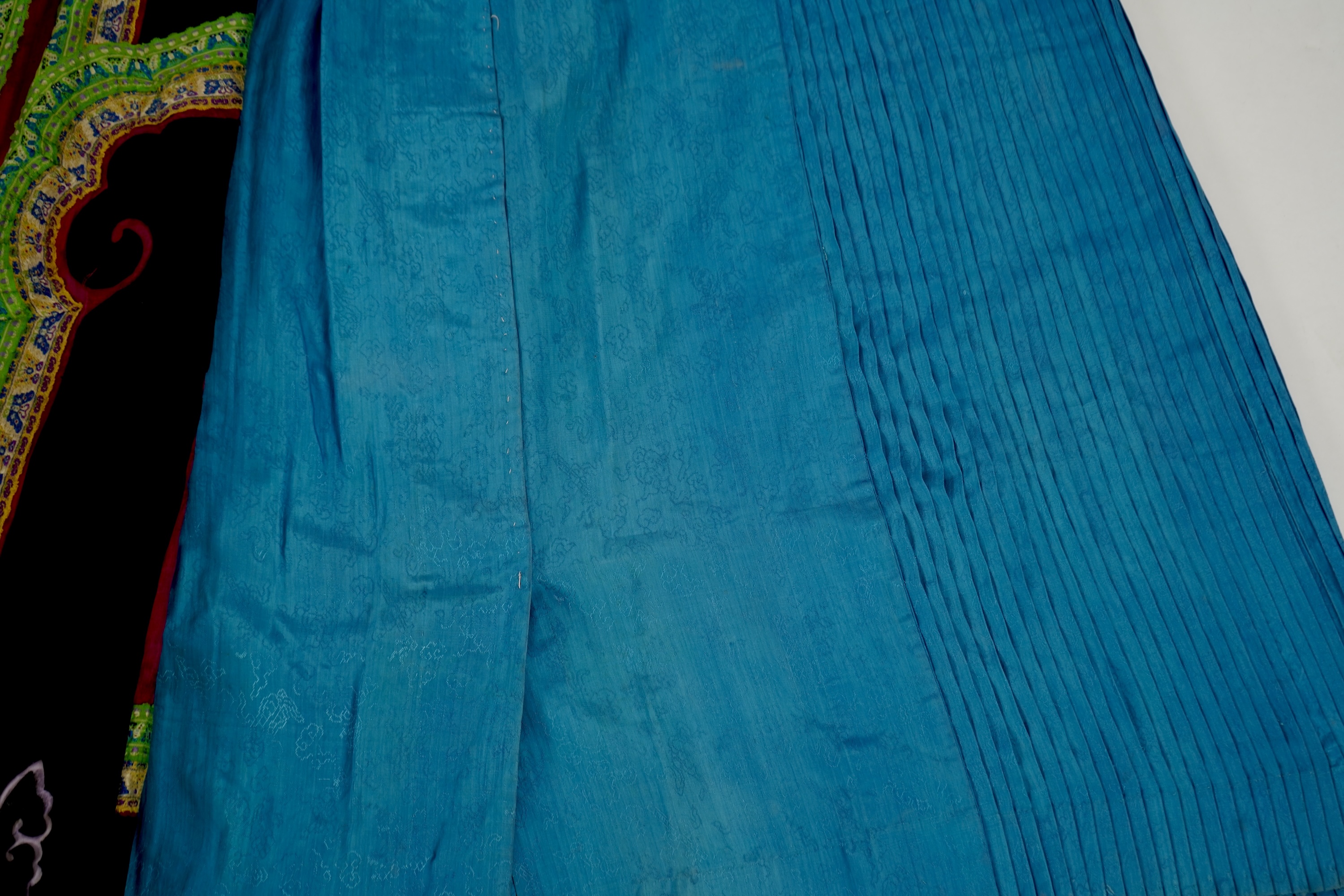 Two Chinese embroidered silk wedding skirts, late Qing, five hats, trousers, two skirt panels and two others, collar and a panel